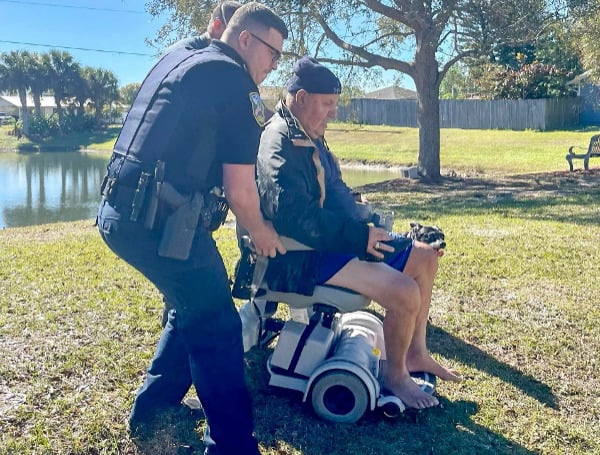 A Florida man was saved by his dog and good samaritans after his electric wheelchair slid into a lake.