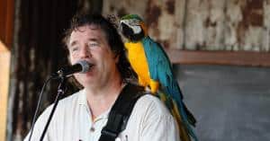 6569538 john with parrot 300x157 1