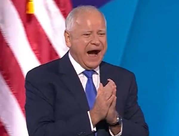 Minnesota Gov. Tim Walz on stage at the Democratic National Convention in Chicago, Aug. 21, 2024.