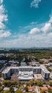 21865915 aerial view gardens residences 168x300 1