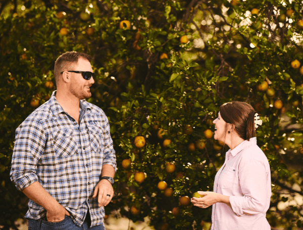 Porter chats with her cousin, Riley McKenna, in the family citrus grove. (Courtesy, Morgan McKenna Porter)